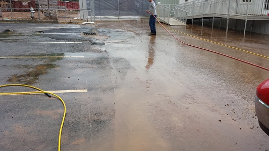 parking lot during pressure washing parking lot during pressure washing
